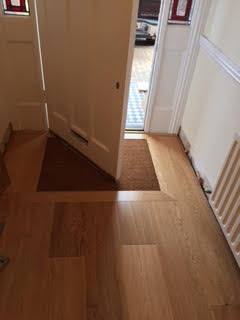 Engineered oak, complete with fitted mat well.
